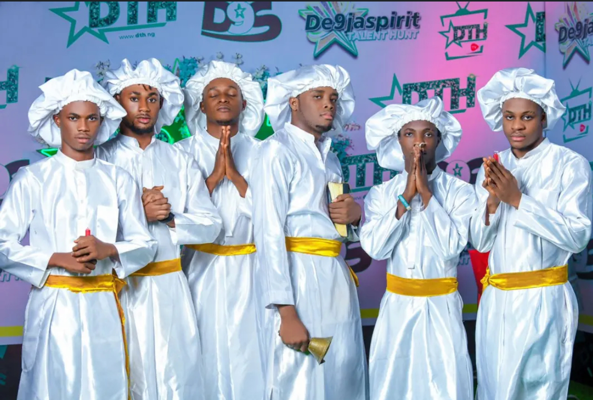 Brothers in Arm in white robes with gold sashes at De9jaSpirit Talent Hunt Season 2.