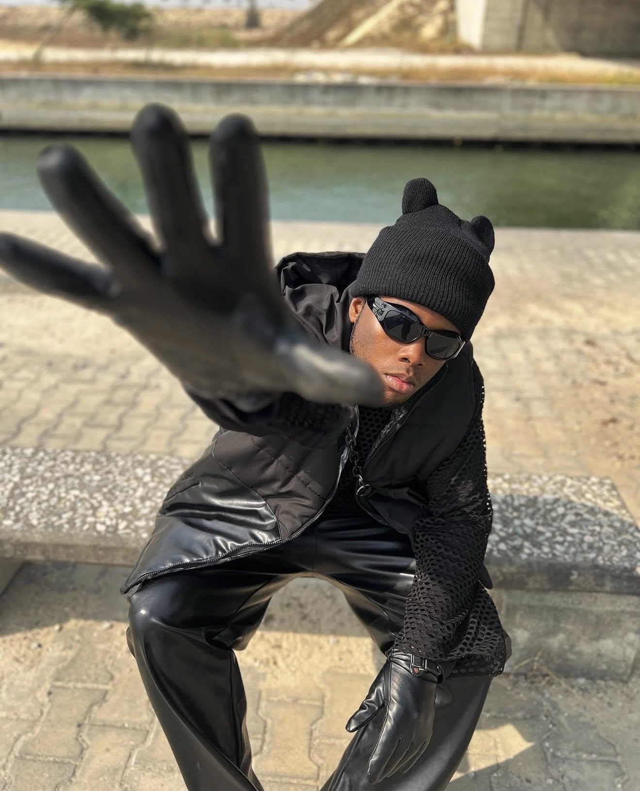 Chibundu Victor Chisom (Vickdance), gloved hand reaching toward the camera