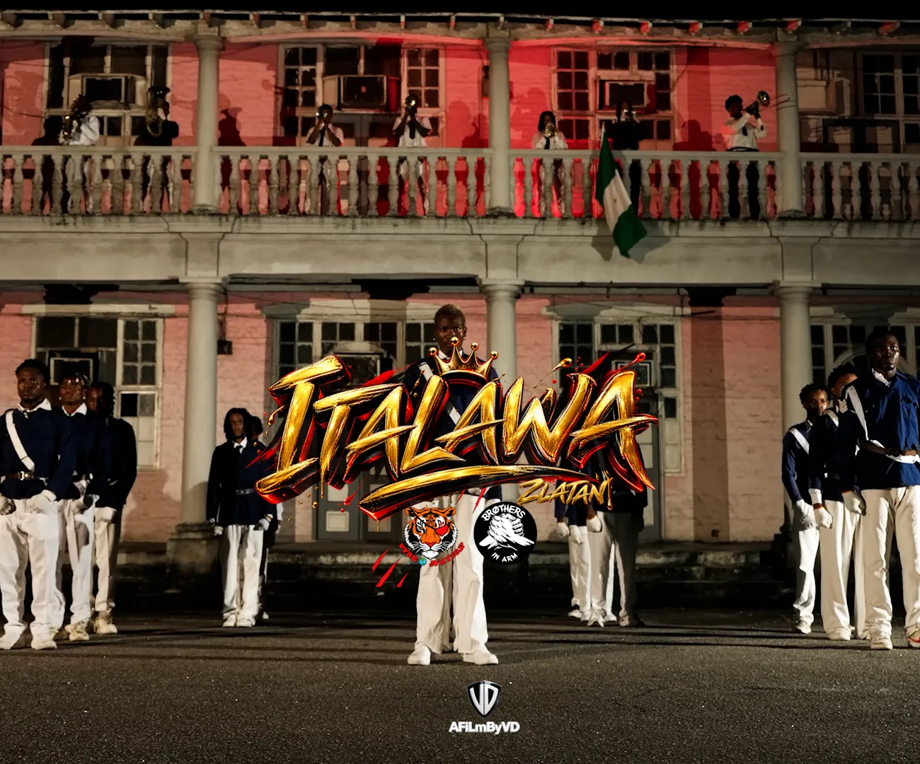 ITALAWA title card — uniformed performers in formation at night before a colonial-era building, brass players on the balcony.