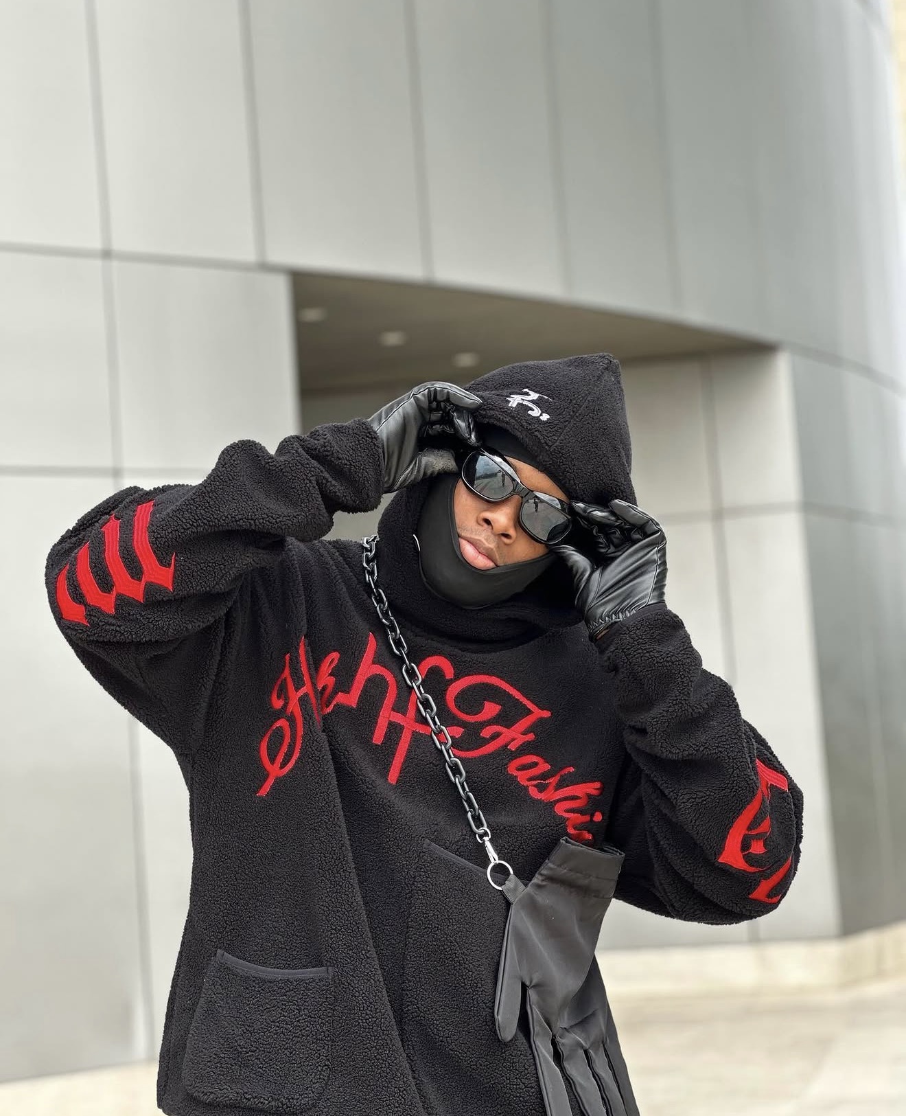 Chibundu Victor Chisom in a black hooded jacket with red graphics