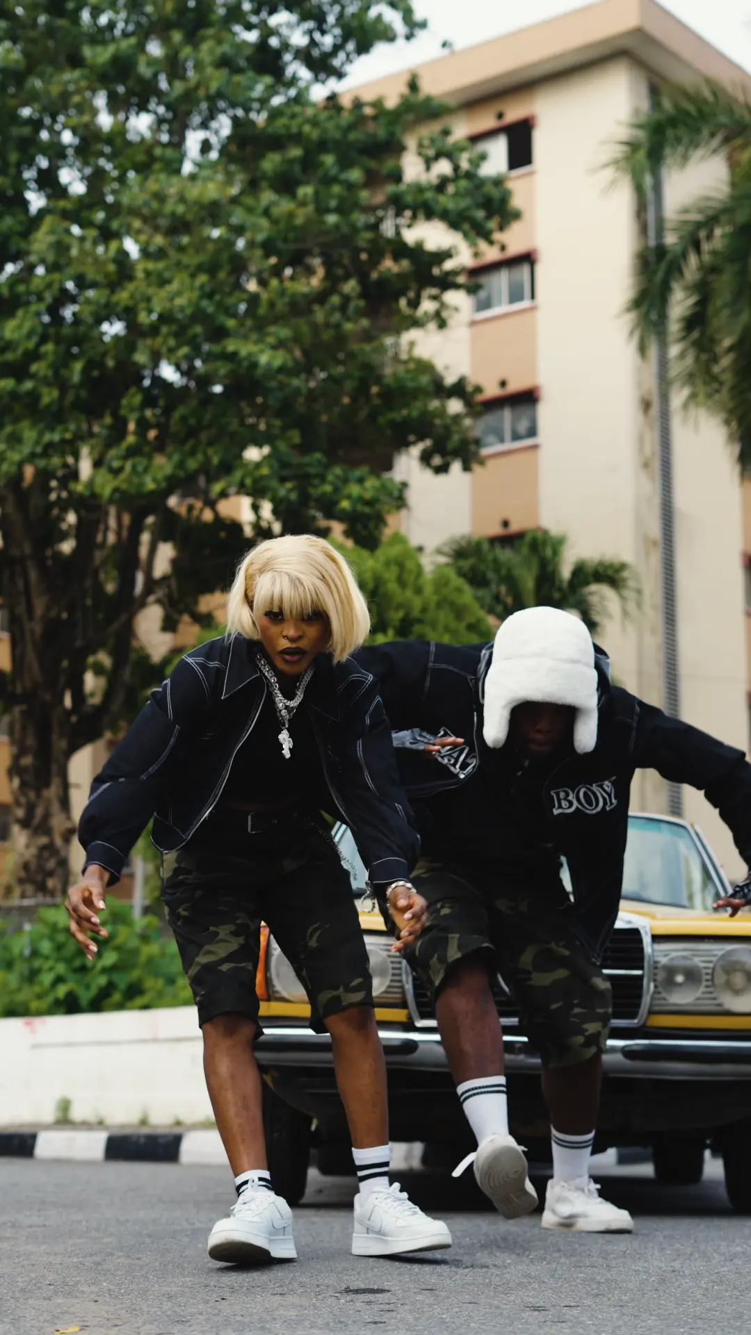 Vickdance performing choreography on a Lagos street.