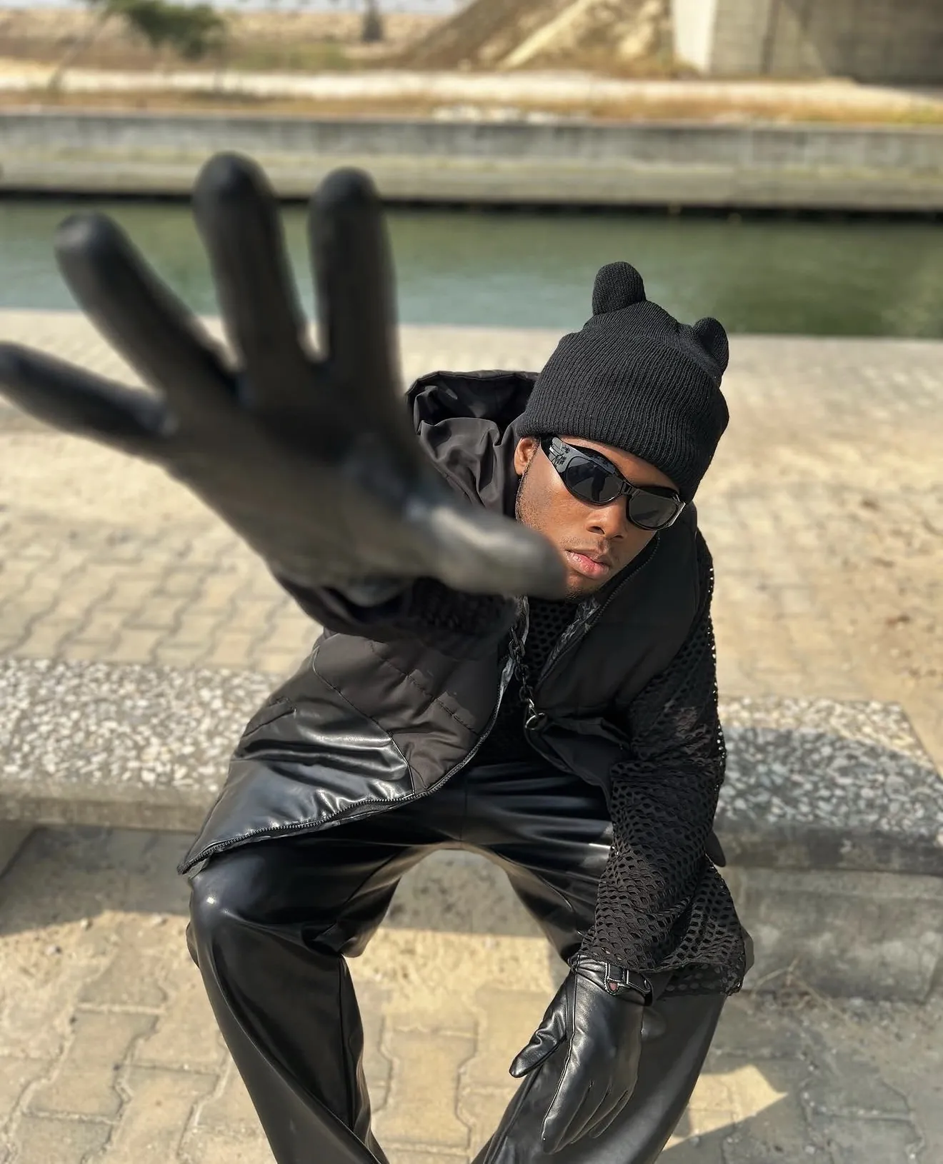 Chibundu Victor Chisom (Vickdance), gloved hand reaching toward the camera